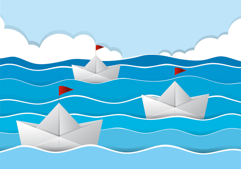 origami boats sailing sea